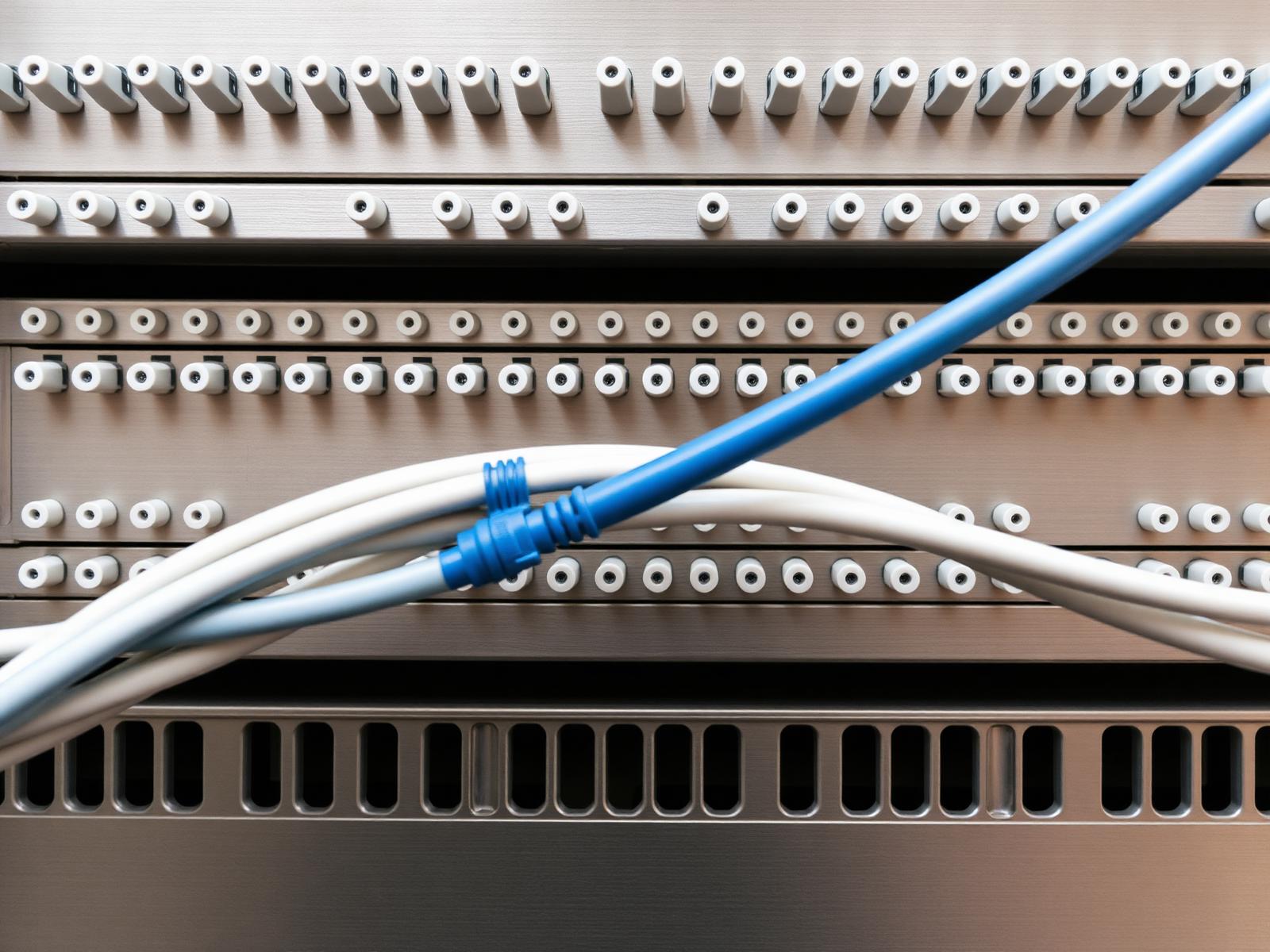 Fiber optic interconnect on a brushed metal patch panel
